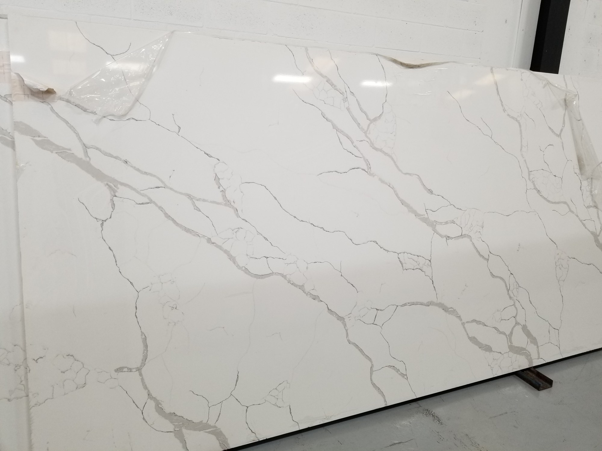 White marble-look slab with feathery veining
