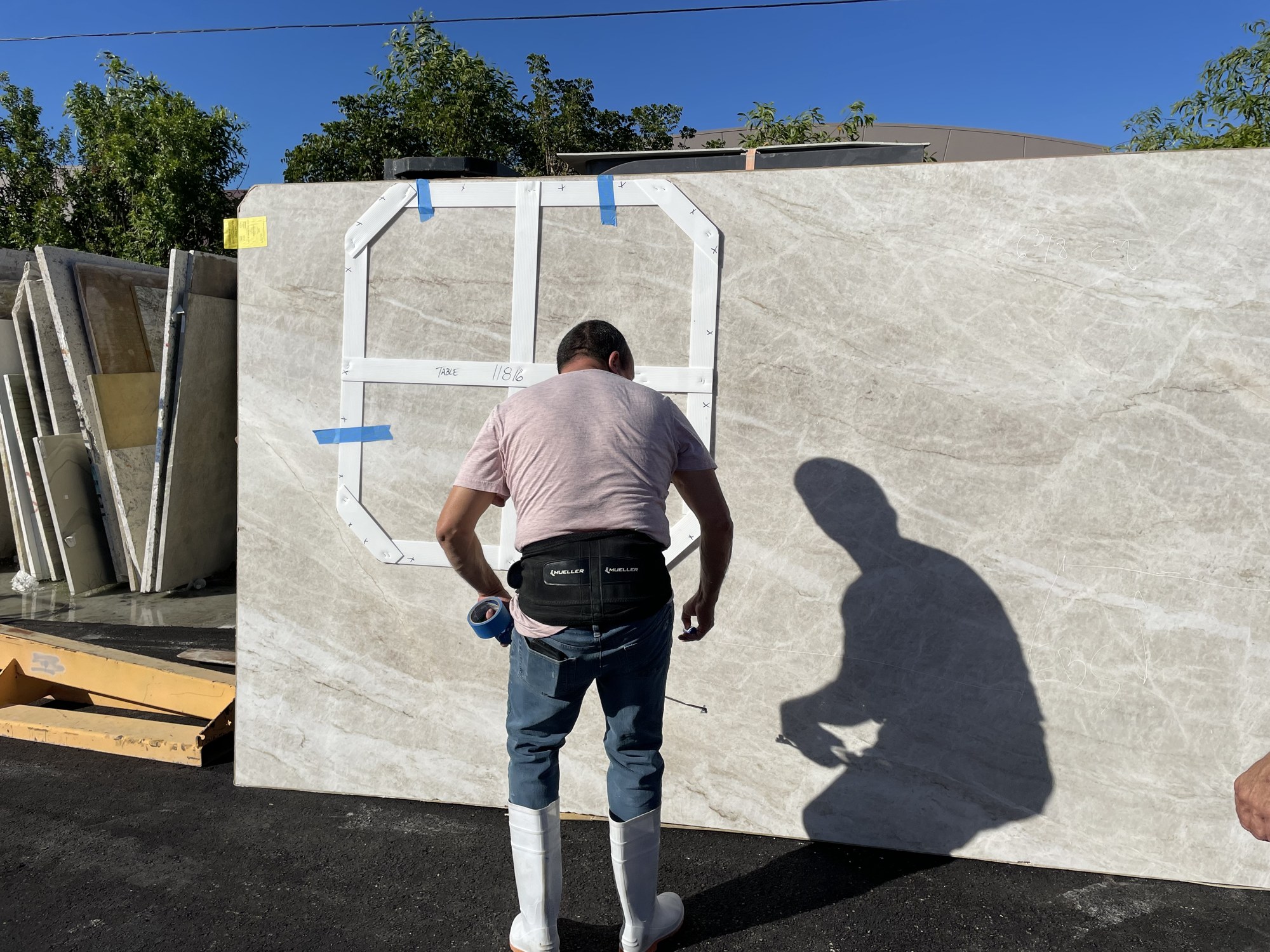 Template outline being marked on a slab in the HB yard