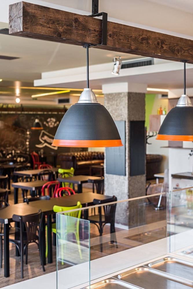 Restaurant service counter with stone top and pendant lights