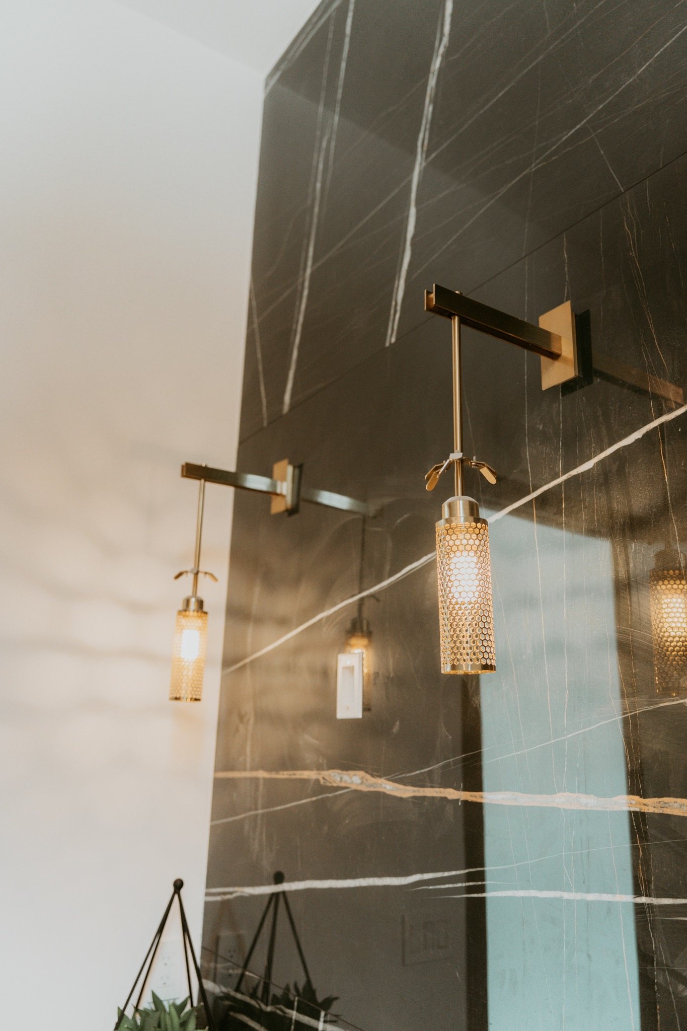 Full-height stone wall panels in a bathroom