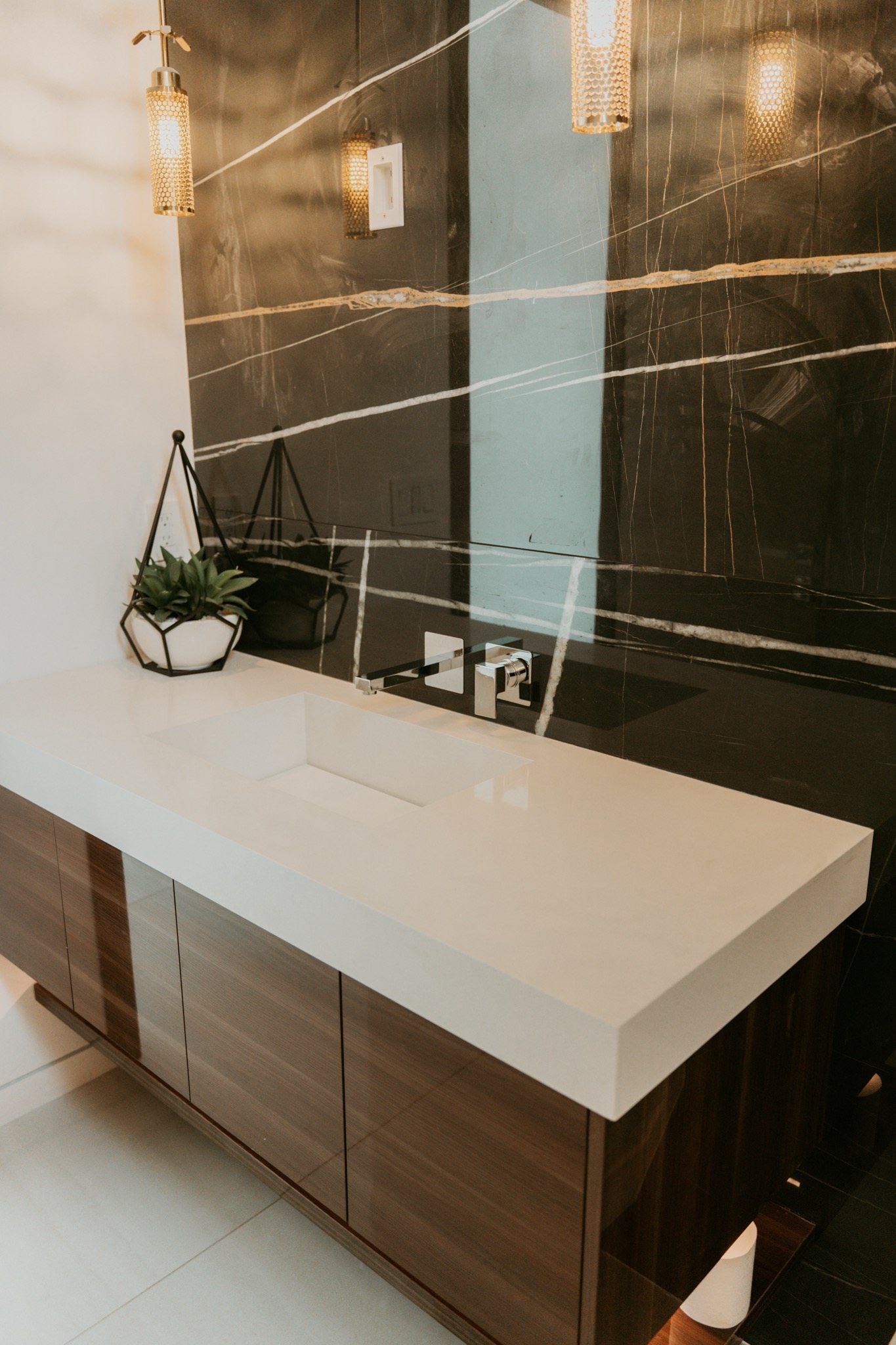 Stone wall behind a floating vanity